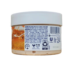 Dove Cinnamon Pumpkin Pie Scrub closeup reveals exfoliation and nourishment for radiant skin.