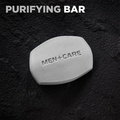 Dove Men+Care Bar charcoal close-up shows exfoliation and clay cleanse.