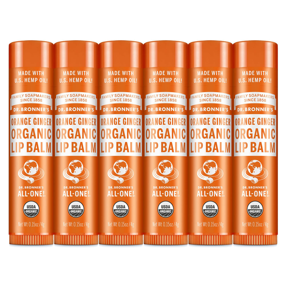 Dr. Bronner’s Organic Lip Balm Orange Ginger application on lips delivers lasting moisture.