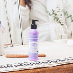 Dr. Bronner's Organic Hair Crème applying on hair demonstrates moisture without heaviness