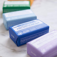 Dr. Bronner's peppermint bar in shower for refreshing cleanse.