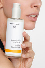 Dr. Hauschka Soothing Cleansing Milk pump-dispense in use on cotton pad