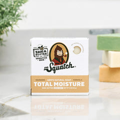 Dr. Squatch Total Moisture Bar unscented lather in hand, gentle cleansing for sensitive skin.