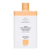 Drunk Elephant Kamili Cream Body Cleanser bottle closeup shows gentle cleansing for sensitive skin.
