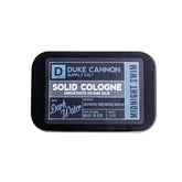 Duke Cannon Midnight Swim solid cologne tin for convenient on-the-go scent touch-ups.