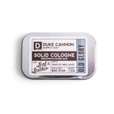 Duke Cannon Old Glory solid cologne tin front view for on-the-go freshness.