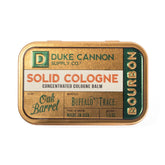 Duke Cannon Bourbon solid cologne tin closeup for on-the-go scent touch-ups.