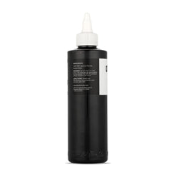 Dynamic Color Co Black Ink 8oz bottle with open cap ready for studio use
