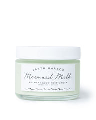 Earth Harbor Mermaid Milk bottle closeup demonstrates hydrating, lightweight skincare