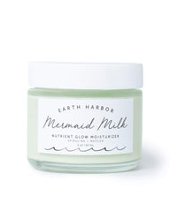 Earth Harbor Mermaid Milk moisturizer bottle emphasizes lightweight hydration for daily use