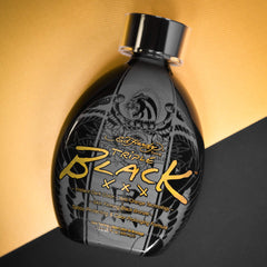 ED HARDY Black XXX lotion swirl on skin indicating rich color and hydration