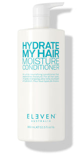 ELEVEN AUSTRALIA Hydrate My Hair conditioner bottle closeup highlights hydration and color-safe formula.