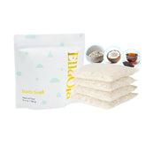 Ellaola Oatmeal Bath Soak tea pack being squeezed releasing nutrients for soothed skin