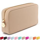 Embla makeup bag sand front view shows compact travel storage for cosmetics.