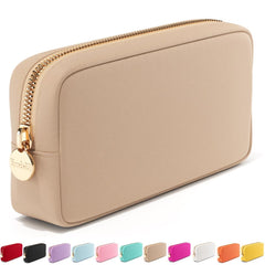 Embla makeup bag sand front view shows compact travel storage for cosmetics.