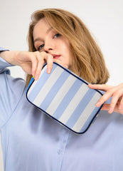 EMBRUNIOICE stripe makeup bag tassel zipper detail highlights stylish organization.