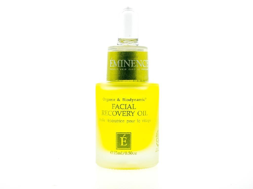 Eminence Biodynamic Facial Recovery Oil bottle pouring shows silky texture that hydrates and enhances glow.