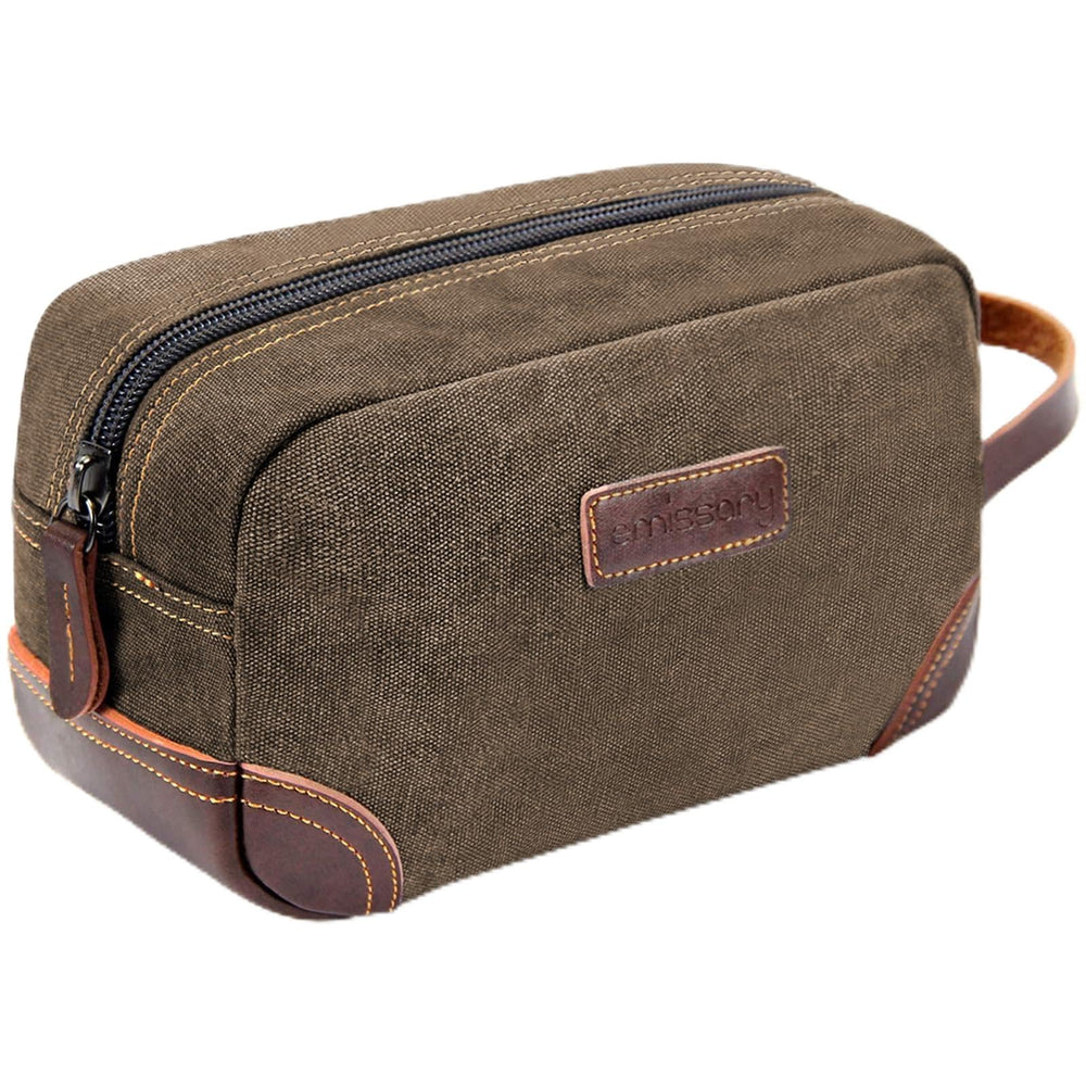 Emissary toiletry bag with leather and canvas material for durable travel.