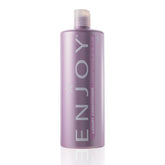 Enjoy Luxury Conditioner bottle pour demonstrates frizz control and hydration