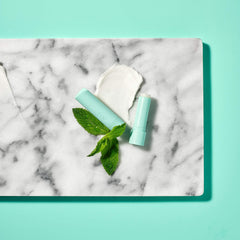 EOS Sweet Mint lip balm close-up highlights smooth texture for sensitive lips