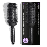 ERGO ceramic ionic round brush barrel closeup, showcasing even heat for smooth, shiny styling.