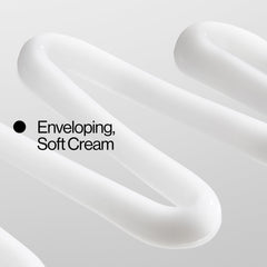Eva NYC curl cream being applied by hands shows easy distribution for smooth curls.
