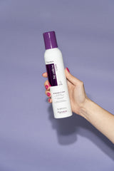 Fanola No Yellow Foam applied to hair during shower for bleached tones.
