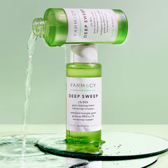 Farmacy 2% Salicylic Acid Toner dropper applying a small amount to smooth skin.