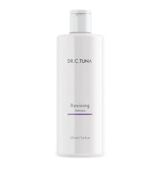 FARMASi Dr. C. Tuna Reviving Shampoo bottle pour showing volumizing formula for fuller hair
