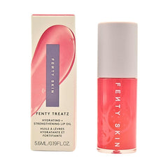 Fenty Skin Fenty Treatz lip oil Dragon Fruit bottle delivers long-lasting hydration with a clear gloss