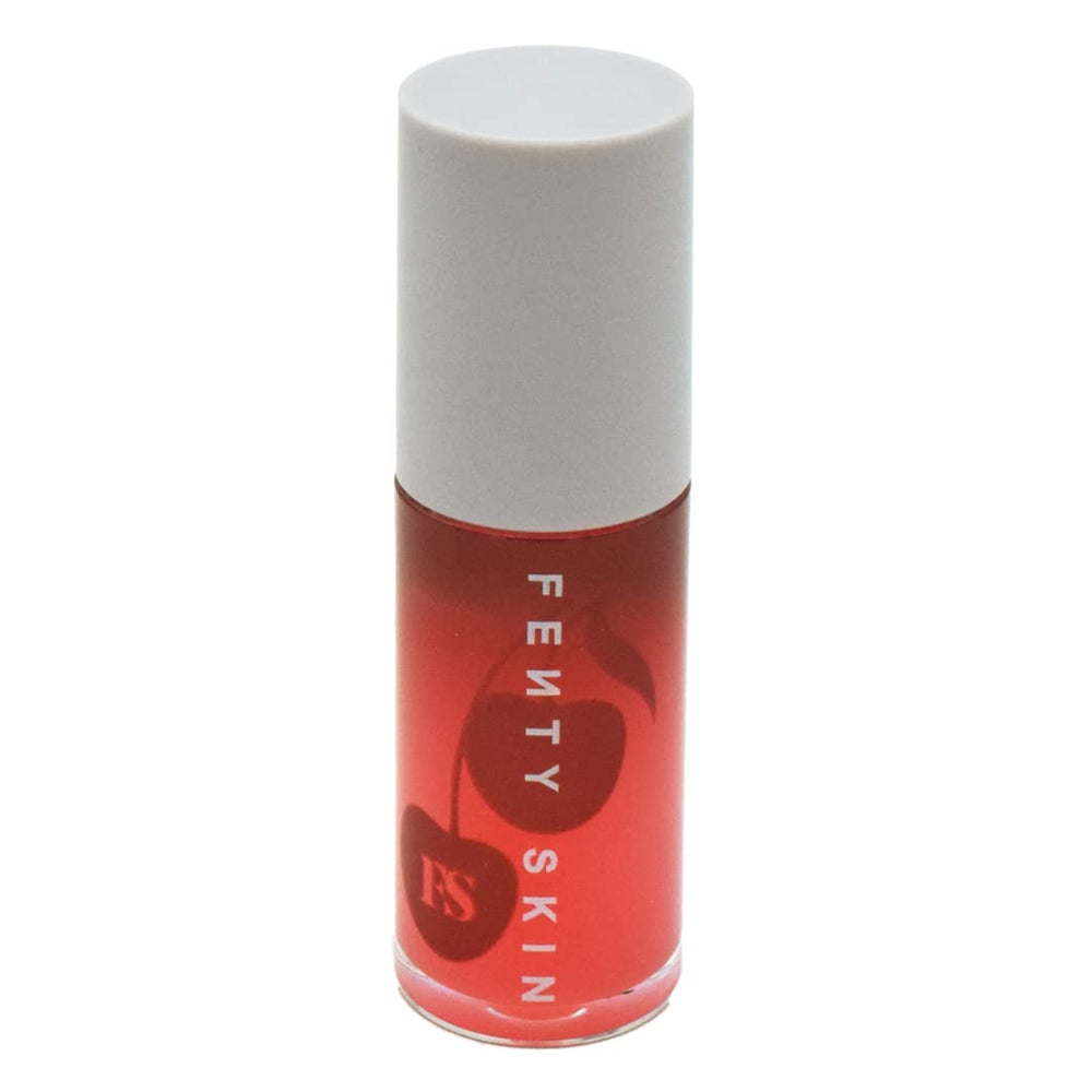 Fenty Skin Treatz lip oil bottle being applied for quick hydration and lip conditioning.