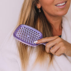 Close-up of FHI Heat UNbrush DuoFlex bristles showing anti-static design for knot release.