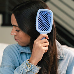 FHI Heat UNbrush DuoFlex anti-static bristles close-up releasing tangles smoothly.