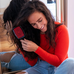 FHI Heat UNbrush Red side grip highlighting ultra-light ergonomic handle