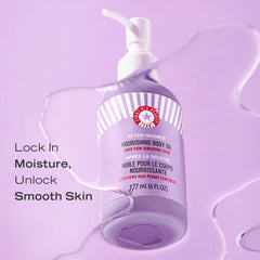 First Aid Beauty After-Shower Nourishing Body Oil drops on skin show hydrating feel and relief