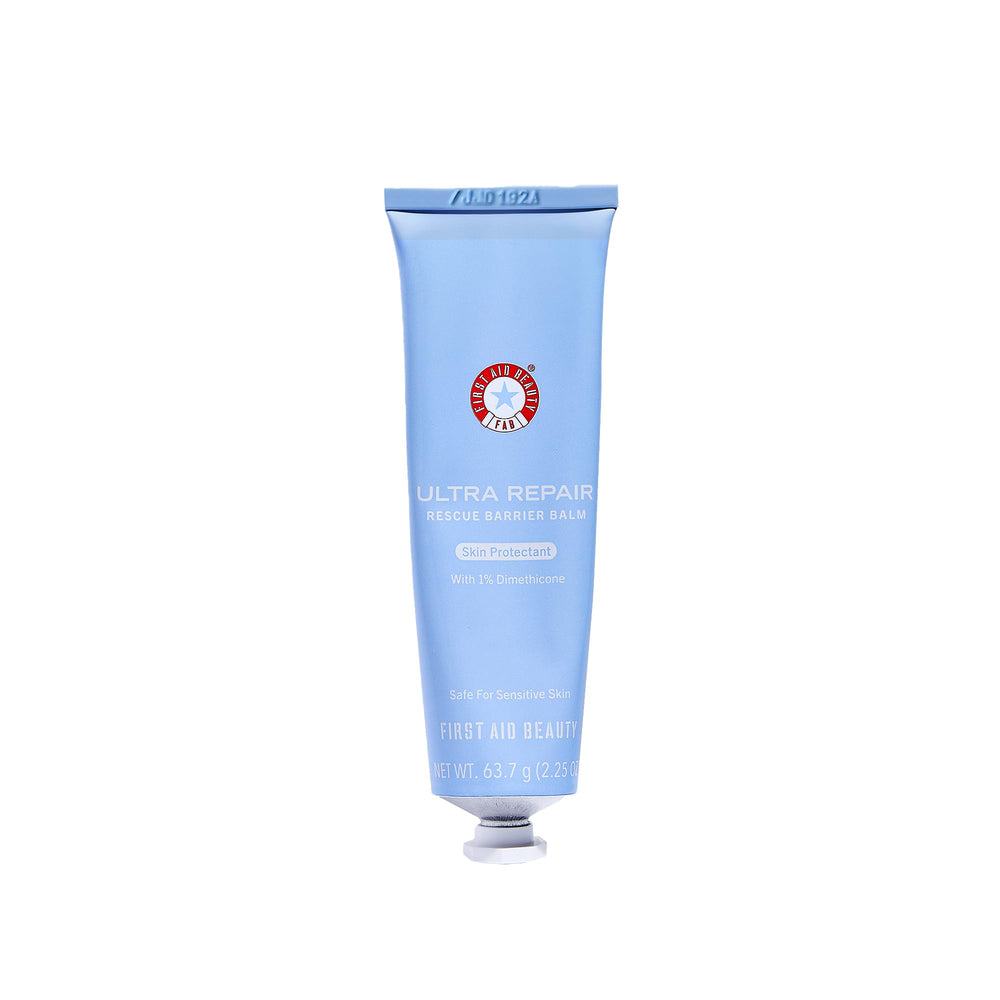 First Aid Beauty Ultra Repair Barrier Balm jar close-up showing a creamy, hydrating texture for dry skin relief.