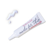 FlutterHabit Made for This adhesive bottle closeup shows clear formula with strong hold.