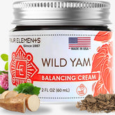Four Elements 4E Wild Yam Balancing Cream bottle pour for soothing application ritual.