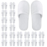 Frcctre white disposable slippers pack ready for guest use and travel.