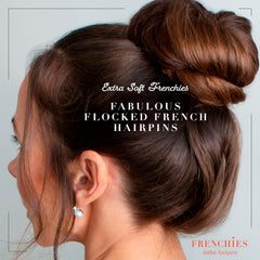 Frenchies rounded ends soft coating pin resting on bun.