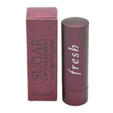 Fresh Sugar Lip Treatment Plum tube shows hydrating lip care with sheer plum tint.