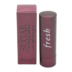 Fresh Sugar Lip Treatment Plum tube shows hydrating lip care with sheer plum tint.