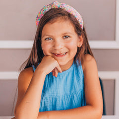 FROG SAC Knotted Headband worn by a child keeps hair back stylishly
