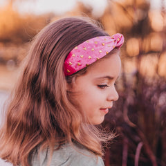FROG SAC heart headband on a girl, pink velvet knot adds cute style to outfits.