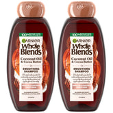Garnier Whole Blends smoothing shampoo twinpack bottle showing frizz control.