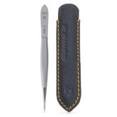 GERMANIKURE pointed tweezers in leather case for precise grooming and on-the-go use.