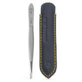 GERMANIKURE slanted tweezers in leather case for precise grooming on the go.