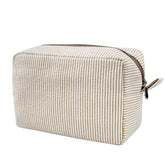 GFU cosmetic bag seersucker brown front view highlights portable travel storage for cosmetics.