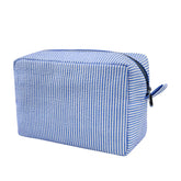GFU makeup bag blue seersucker front view highlights lightweight travel-ready design