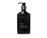 Gilchrist & Soames Warm Oak bottle pour for luxurious cleansing experience.